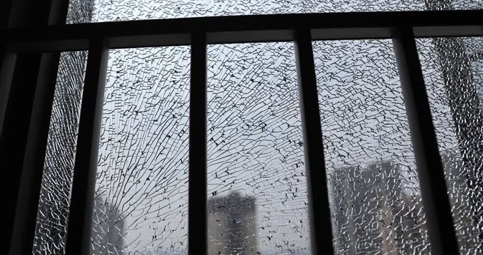Broken window glass of modern apartment