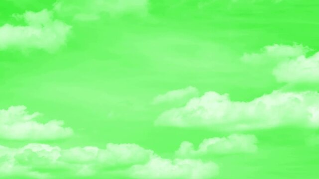 Bottom view of dramatic white clouds moving across a bright green screen, light soft panorama sunset sky background.
Isolated white cumulus cloud floating against a vibrant green screen background