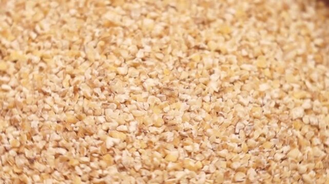 Rotation of spelt as a texture close-up. Top side view