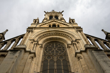 Fototapeta premium Dramatic Low Angle View of Gothic Church Facade and Rose Window