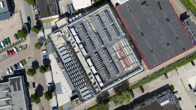 Diemen, Netherlands - 05 June 2026: Aerial view of Switch Datacenters AMS4 surrounded by industrial buildings, warehouses, and a canal in the Netherlands.