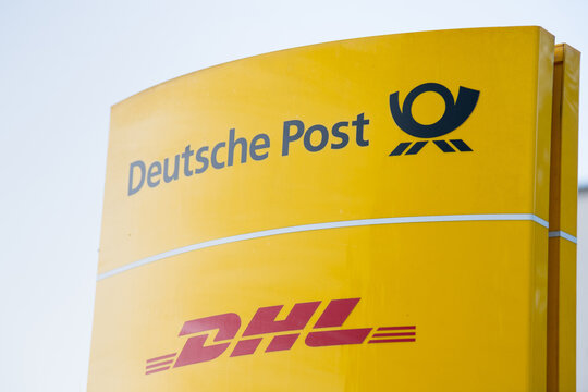 Deutsche Post brand logo sign, deliver parcels and letters in Trier, Germany, courier, shipping and transportation service business