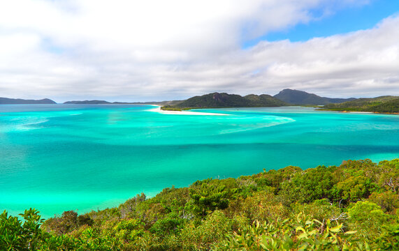Hill Inlet Whitsunday Islands in Australia, depicting flowing tropical colors.