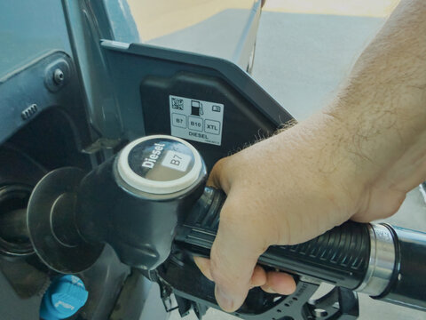 Refueling Car at Gas Station