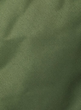 Dense synthetic olive khaki fabric texture with fine plain weave and soft folds, close-up background