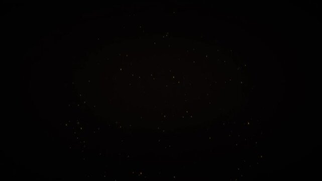 Golden fireworks exploding on black background for holiday celebration