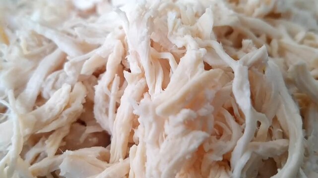 Shredded chicken meat cooked and ready to eat or use as ingredient