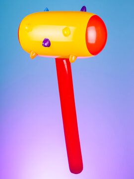 Close-up of an inflatable mace with spikes on a purple background, emphasizing its rugged and bold design&mdash;perfect for playful battles or quirky decor
