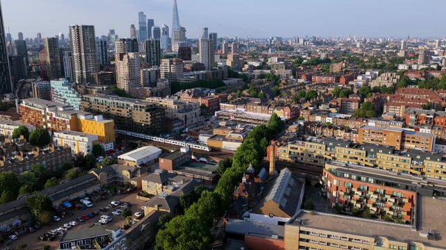 Aerial video featuring  the prominent high-rises of Elephant & Castle and the City of London financial district at late afternoon.