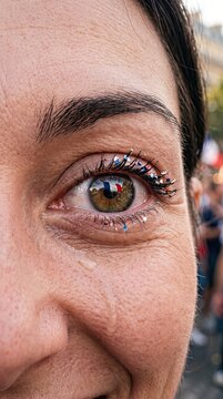 France celebration crowd closeup of woman's eye on Bastille Day festival