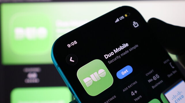 Smartphone held in hand displaying mobile application store page for duo mobile app store.