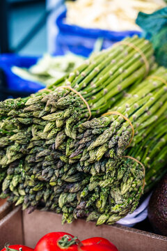 Fresh green asparagus bundles at the market