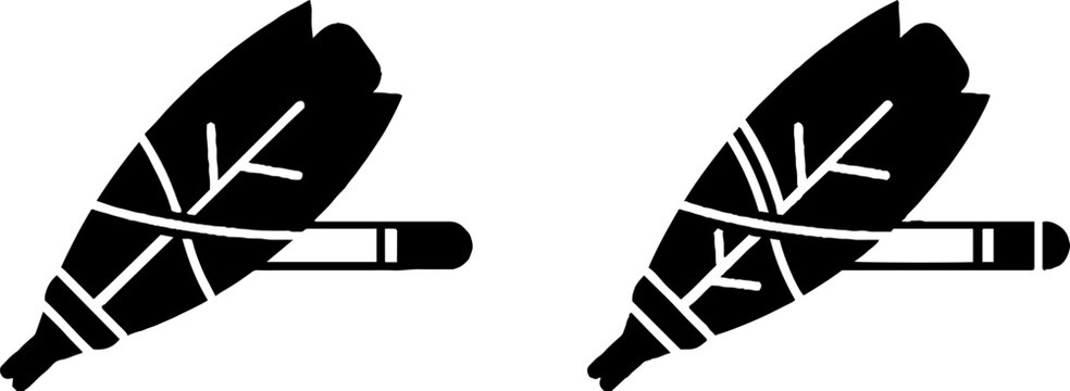 Two black feather quill pens with intricate vein details.