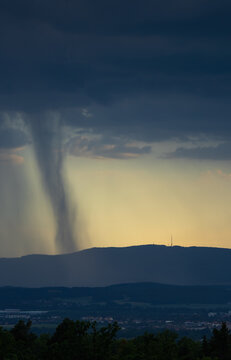 Close-up of a rain shaft and microburst over Klet mountain with transmitter during a summer storm