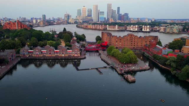Aerial video of Shadwell Basin Pier in East London and Canary Wharf Skyline