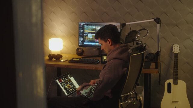man working on laptop at home desk