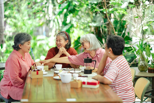 Senior women enjoying coffee and conversation together. Friends gathering, retirement lifestyle, social connection, friendship, coffee meetup, community, everyday moments, cafe lifestyle.