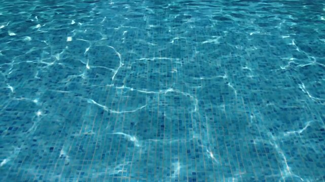 Underwater caustic light patterns dance on a blue tiled pool surface, creating a mesmerizing water texture and relaxing atmosphere