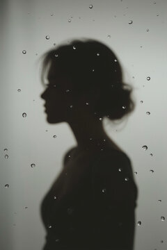 Intimate Female Silhouette Behind Wet Glass with Water Droplets, Self Care, Vulnerability and Wellness Concept