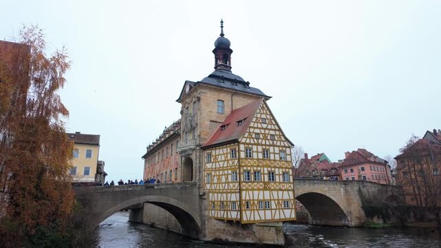 Picturesque old town hall, or altes rathaus, standing on an artificial island in the regnitz river, a famous medieval landmark and a top travel destination for tourists in bamberg, bavaria