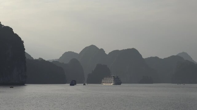 Cruise Ships and Boats Navigating Limestone Karsts Halong Bay Vietnam