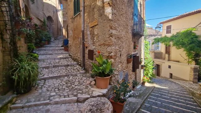 POV Walking Through Empty Medieval Casperia Italy Narrow Cobblestone Alleys Authentic Stone Architecture with Potted Flowers Old Wooden Doors and Mosaic Tables Charming Borgo Hidden Gem Cinematic 4K 