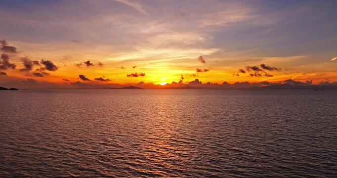 Aerial drone view of a sunrise over the sea during golden hour in Zhuhai, China