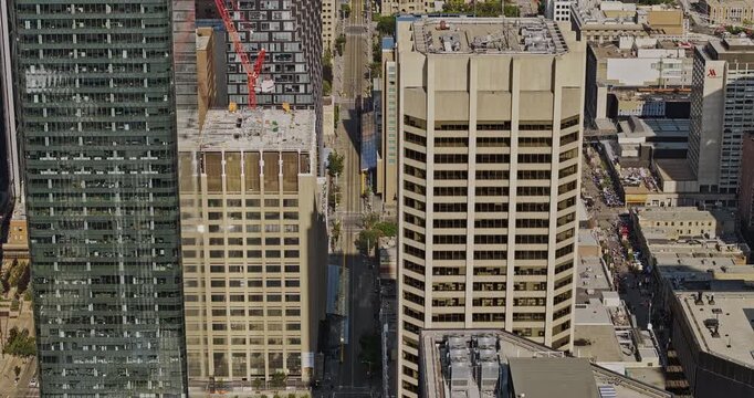 Calgary AB Canada Aerial v39 zoom drone flyover downtown commercial area along 7 Ave SW capturing light right street, office buildings and municipal city hall - Shot with Mavic 3 Pro Cine - July 2023