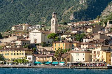 Fototapeta premium Old town harbor and lakefront view, Limone sul Garda, Italy
