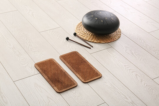 Sadhu board with glucophone on floor in living room
