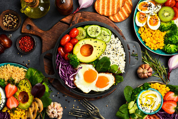 Obraz premium Buddha bowl. Set of healthy and nutritious food in bowls. Top view. Dietary nutrition.
