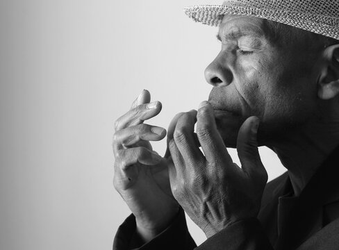 A serene portrait of a man praying with hands together in deep prayer that perfectly captures themes of faith, hope, mindfulness, and inner peace stock image stock photo
