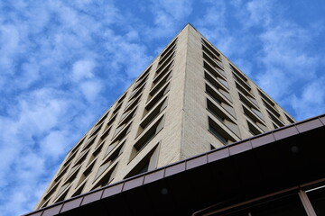 Obraz premium Close-up of a modern residential building facade in Sweden showing repetitive windows and urban architecture in daylight.