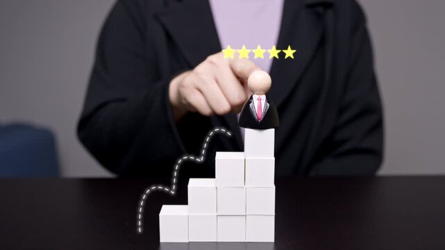 Businessman wooden doll on top of block stairs with a five star rating and growth line graphics, representing career success, top performance, and excellent customer satisfaction.