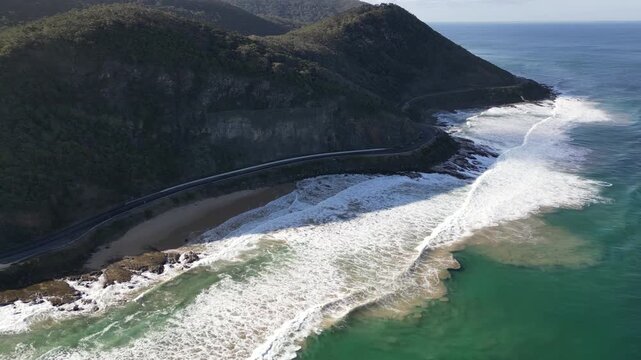 Aerial view of nature landscapes on Great Ocean Road Australia with mountains hills and scenic highway along the Southern Ocean in Victoria