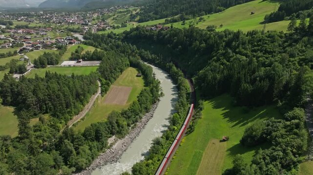Aerial panorama of authentic alpine villages in Tyrol Austria with scenic valleys towering mountain ranges dense forests and natural beauty of Europe