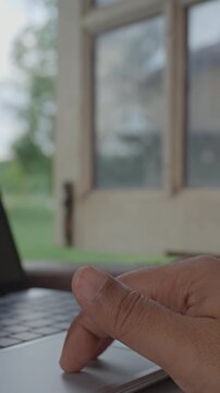 Close-up of hand clicking and performing pinch to zoom gesture on laptop touchpad, vertical business technology workflow, modern user interface interaction, copy space, zoom in, Remote work, Nature
