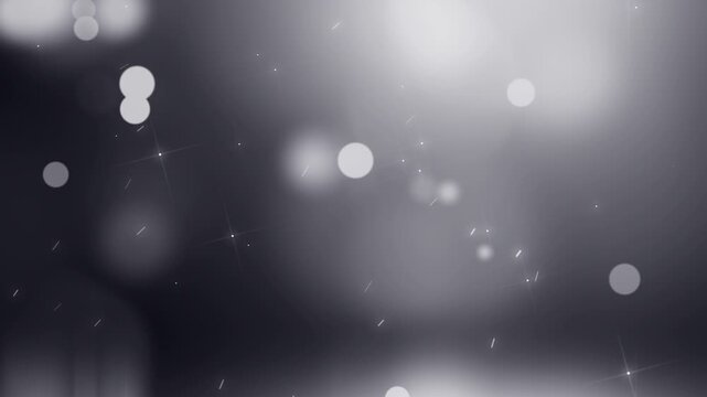 Monochromatic background with white bokeh lights on a dark gray gradient with a white band at the bottom.