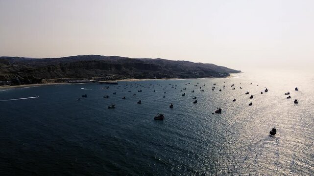 Aerial View of Fishing Boats Near Ecuador Coastline at Sunset, Shimmering Pacific Ocean, Sandy Beach, Coastal Hills and Seascape Background