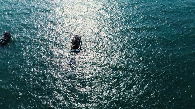 Top Down Drone View of Fishing Boats on Blue Pacific Ocean in Ecuador, Sunlit Water Texture, Small Boats and Coastal Maritime Travel Background