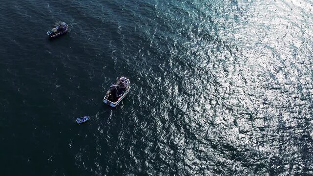 Drone View of Small Fishing Boat on Dark Blue Ocean in Ecuador, Sunlit Water Texture, Maritime Travel, Coastal Lifestyle and Seascape Background