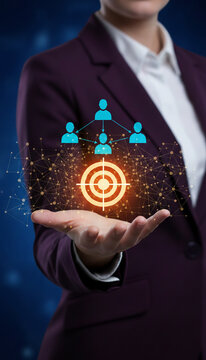 Hand holding glowing target and network icons, symbolizing business strategy, connection, and achievement, a conceptual representation of success