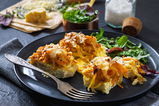 Cheesy Veggie Baked White Fish on a plate