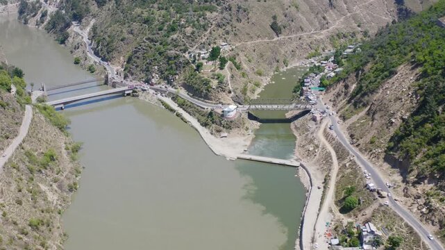 Aerial view of Pull Doda Bridge and Chenab River confluence in Jammu and Kashmir.