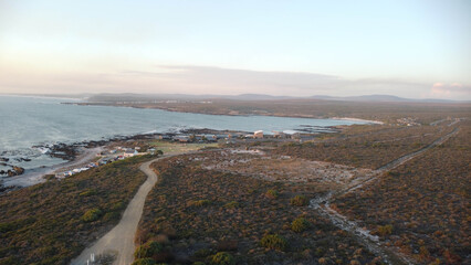 Aerial view of  Ganzekraal Coastal Resort is a popular, tranquil seaside getaway located right on the Atlantic Ocean with tidal pool and campsites. © Fearless on 4 Wheels