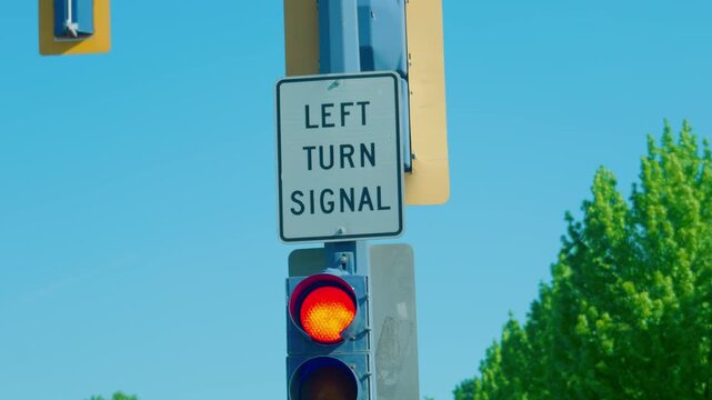 Left turn signal traffic sign and illuminated red light