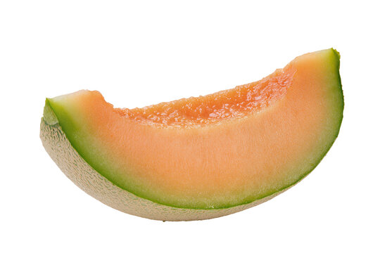 Isolated fresh ripe juicy slice of cantaloupe melon showing vibrant orange flesh and green rind