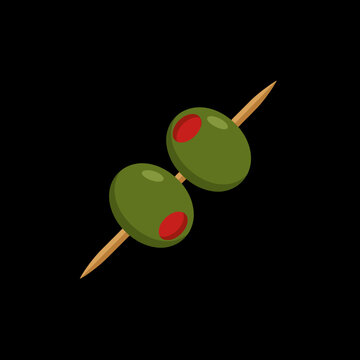 Two green olives are skewered on a wooden cocktail pick