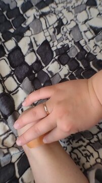 A person applying an adhesive bandage plaster to a bleeding blister wound on their foot heel. Vertical stock footage for first aid care, footwear friction injuries, and skin protection.