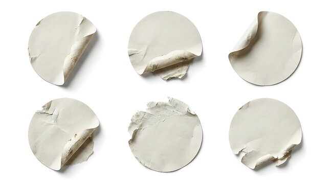 Six broken white pills on surface.